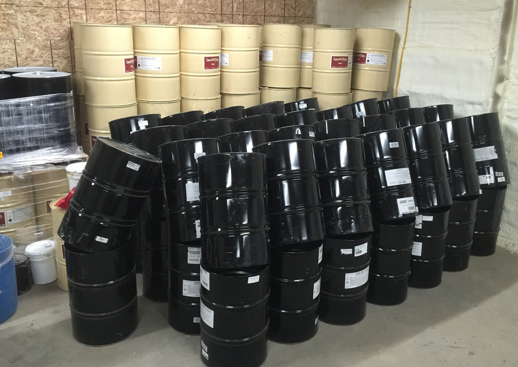 Drums cut and drip drying, readying for recycling